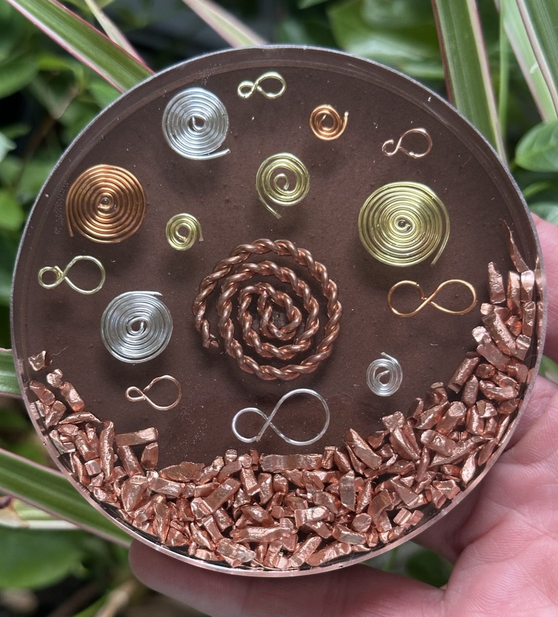 Handmade orgone coaster with copper fish design in sea-toned resin layered with shungite and copper