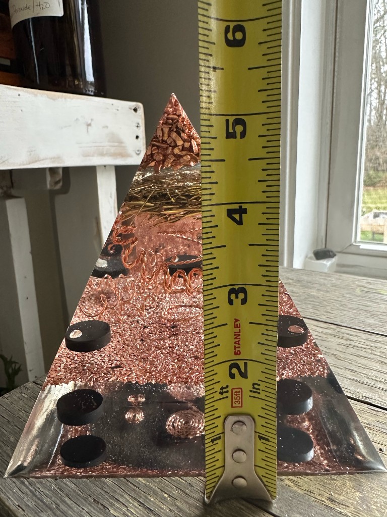 Large orgonite pyramid height measurement showing approximately 5.5 inches