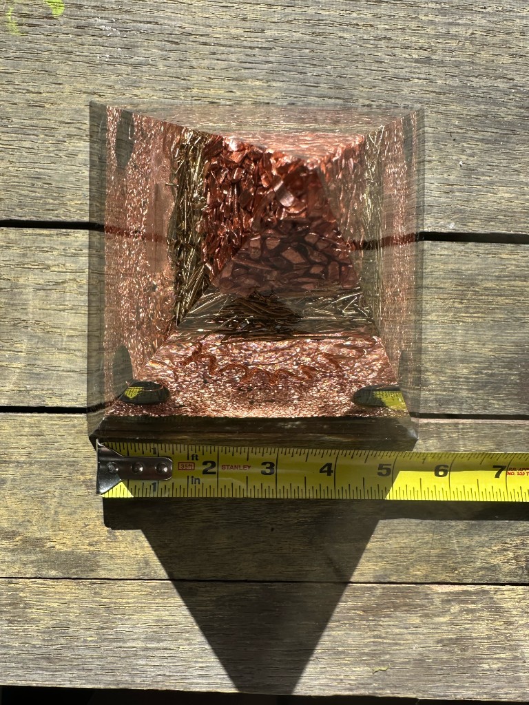 Large orgonite pyramid base width measurement showing approximately 5.5 inches