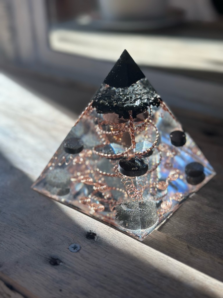 Small orgonite pyramid showing copper coils and labradorite