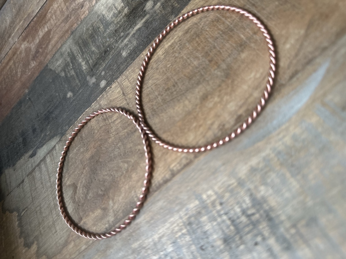 Sacred Cubit 144Hz tensor ring in spun 14-gauge copper wire, half cubit size.